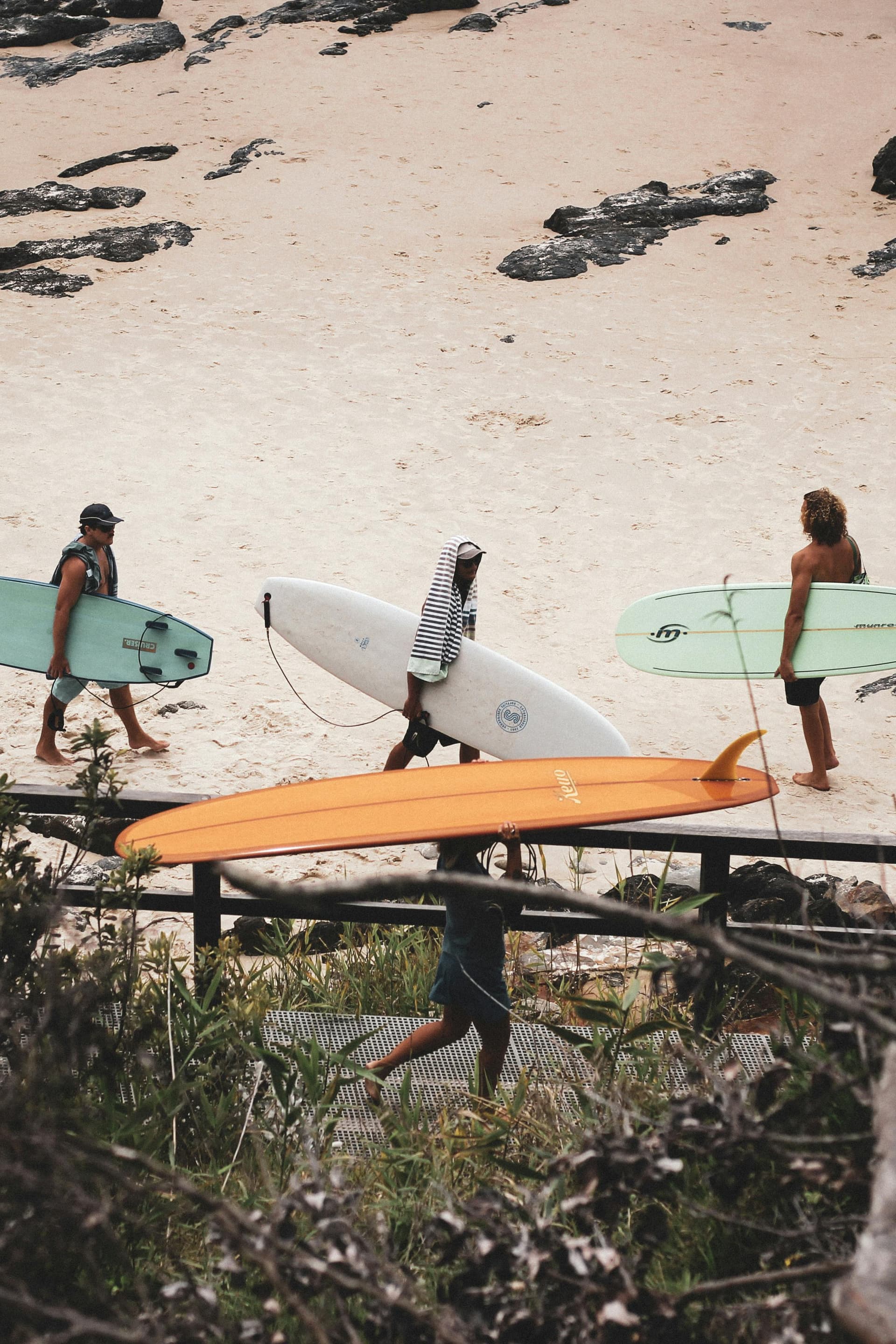 Surfers heading to the beach in Byron Bay